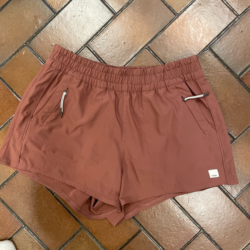 Vuori Women's Athletic Shorts in Rust